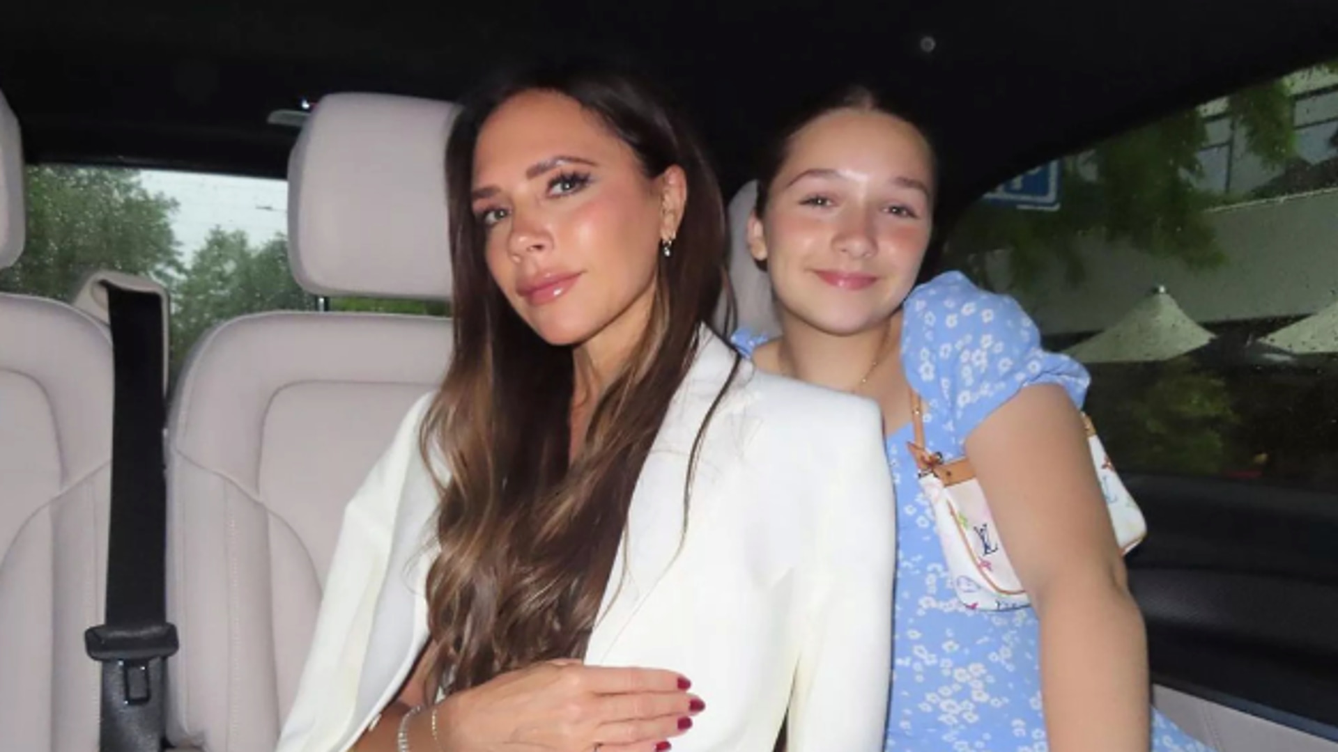 Harper Beckham is a vision in blue silk dress as she presents mum Victoria with special award