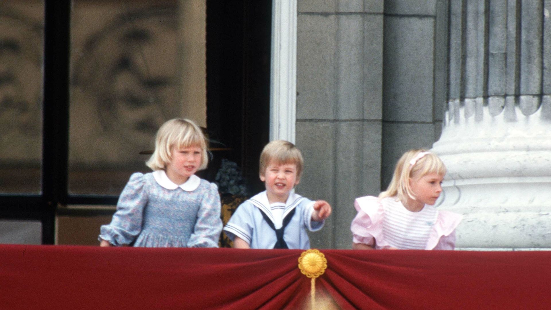 A young Zara Tindall, Prince William and Lady Davina Windsor on the Buckingham Palace balcony
