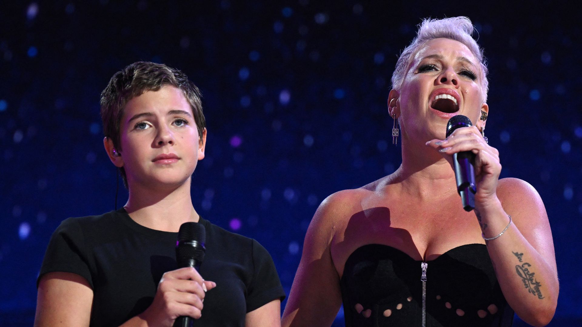 Pink (R) and her daughter Willow (L) perform on the fourth and last day of the Democratic National Convention (DNC) at the United Center in Chicago, Illinois, on August 22, 2024