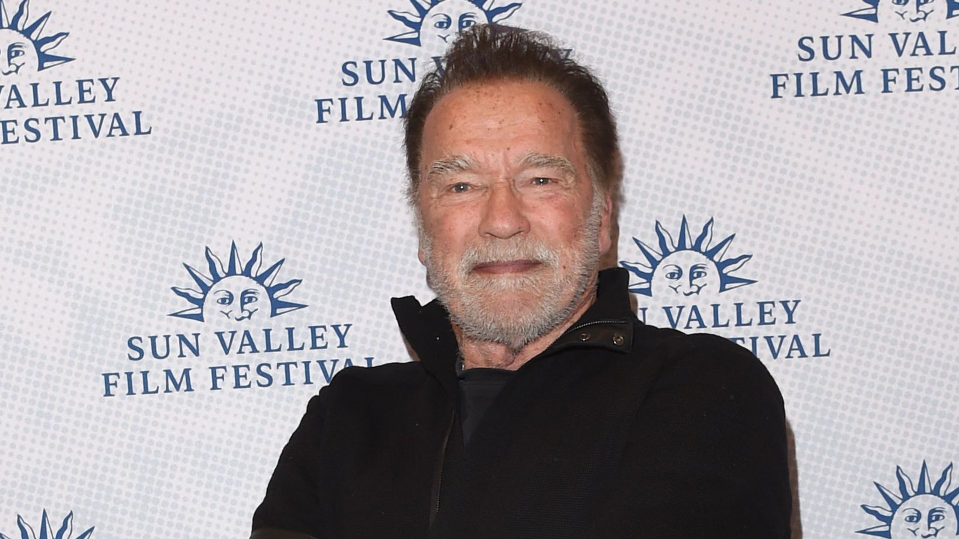 Arnold Schwarzenegger in black jumper and jeans at 2025 Sun Valley Film Festival