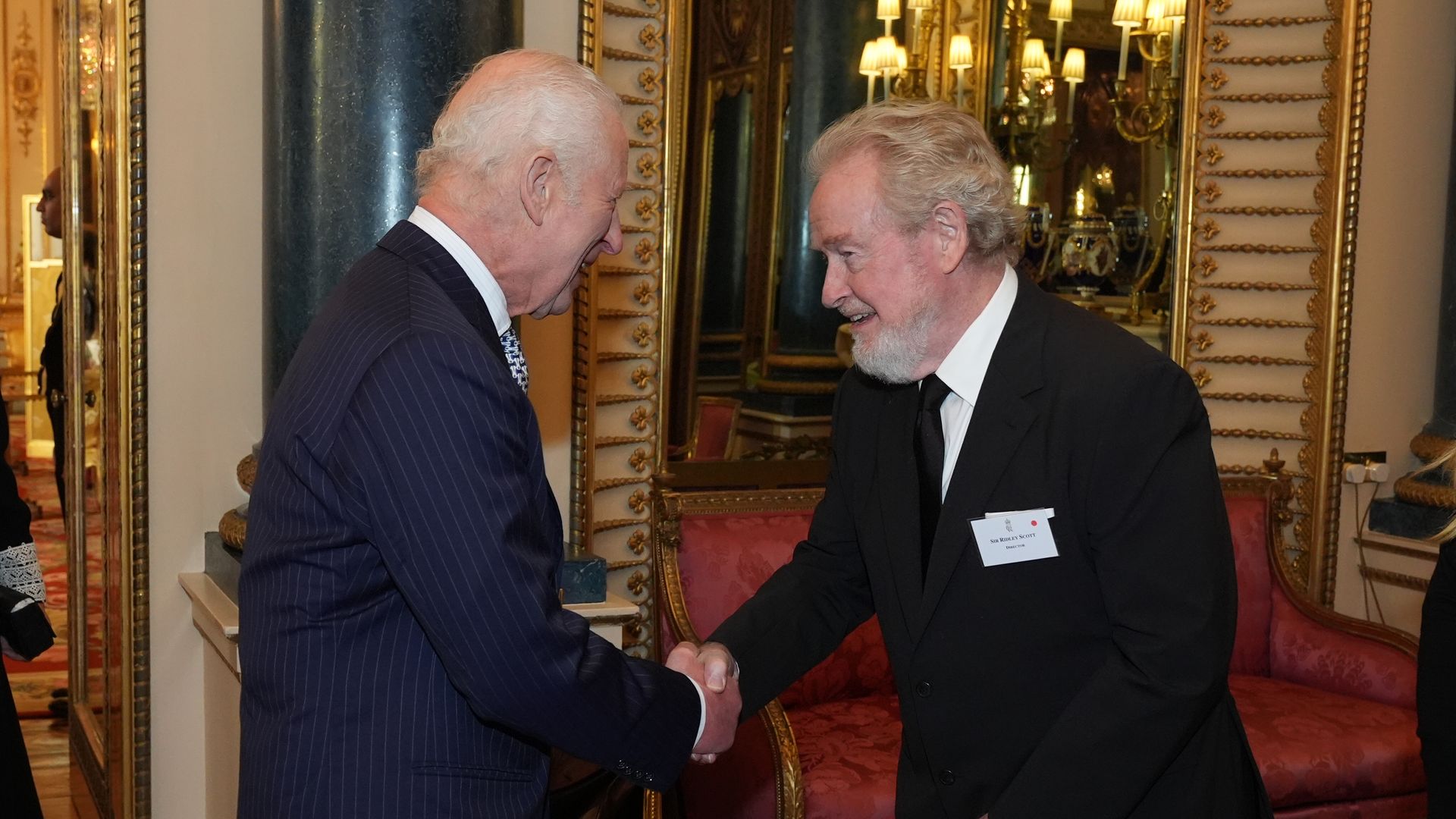 King Charles shaking hands with Ridley Scott