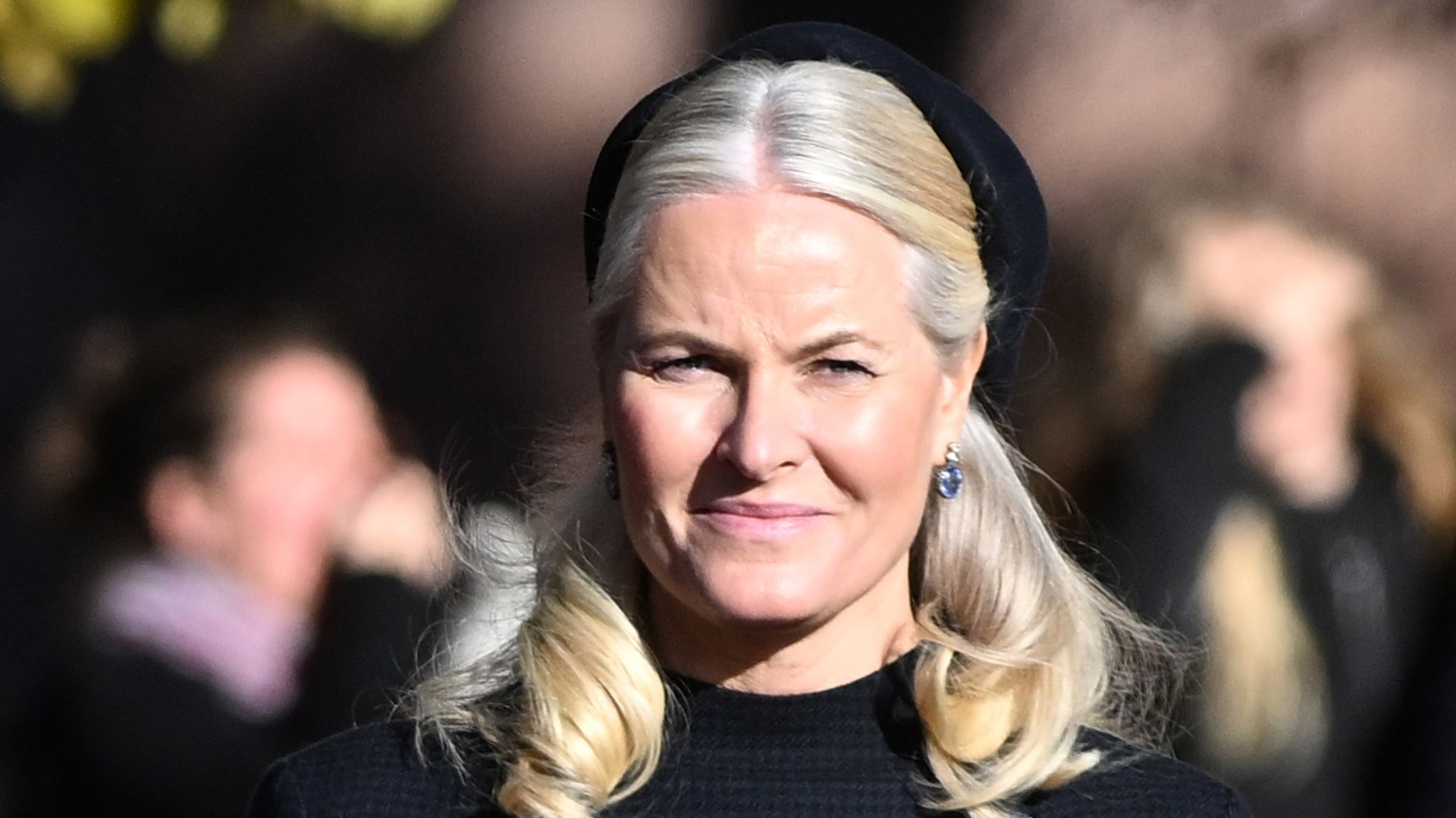 Crown Princess Mette-Marit in black during a state visit from Finland