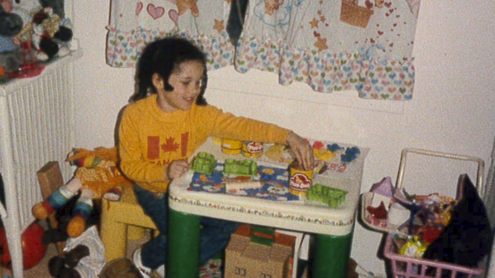 A young Meghan Markle playing with Play-doh