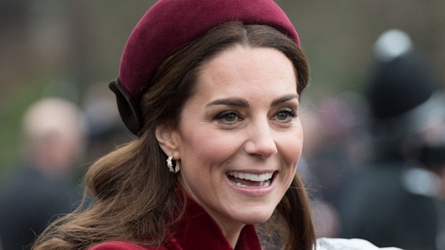 Kate Middleton wearing red coat and hat at Christmas