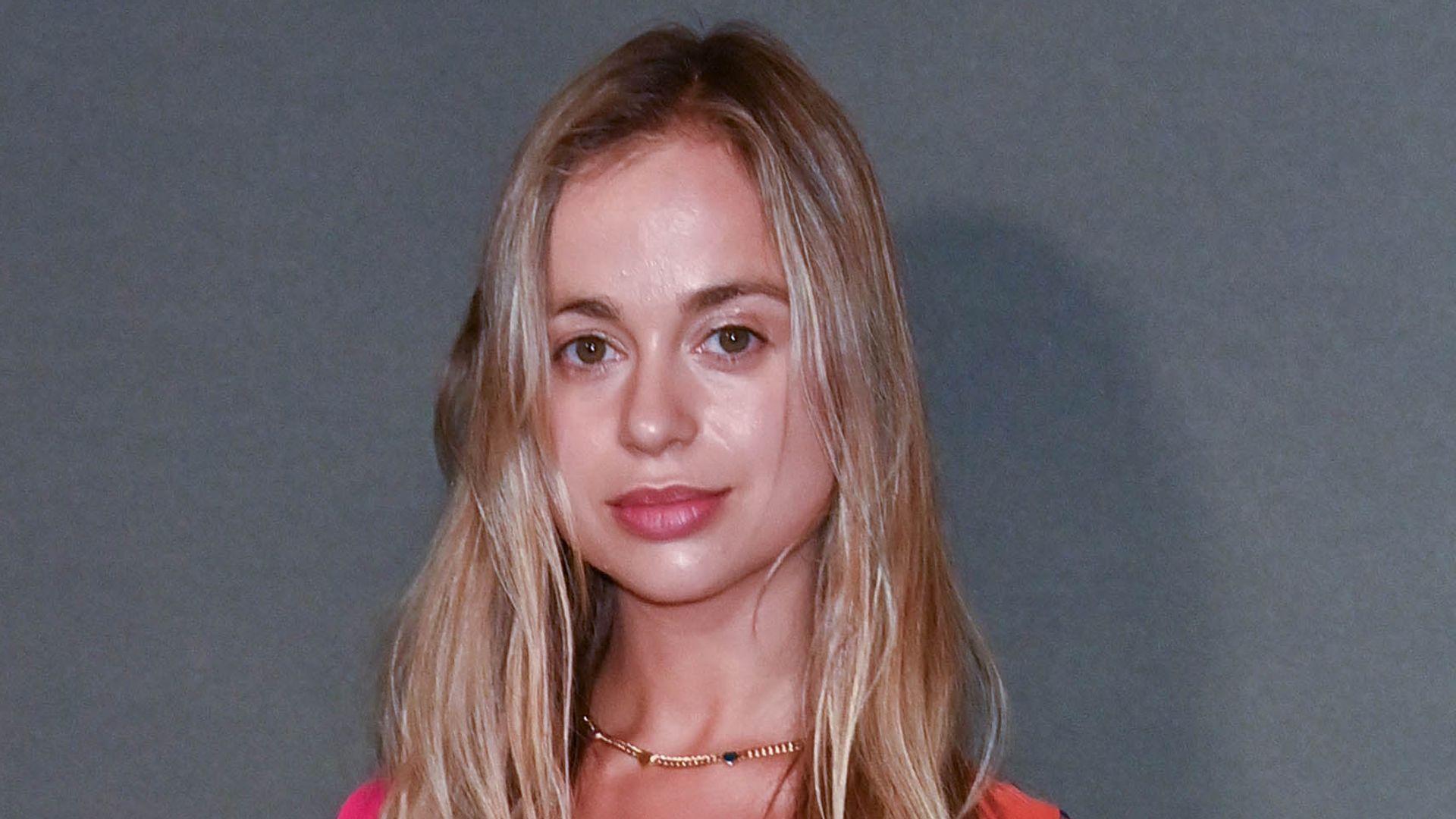 Lady Amelia Windsor in a pink and orange dress