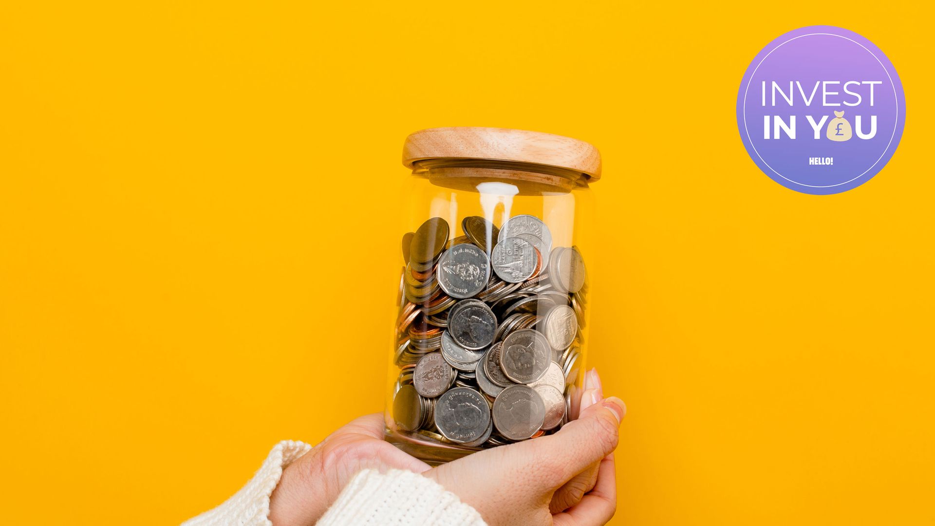 Woman holding jar of pennies against yellow background