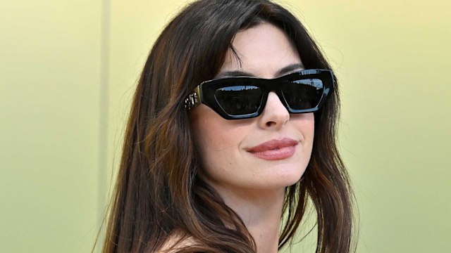 Anne Hathaway wearing black sunglasses