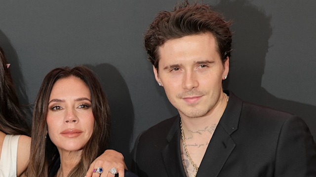 Victoria Beckham standing with Brooklyn Beckham