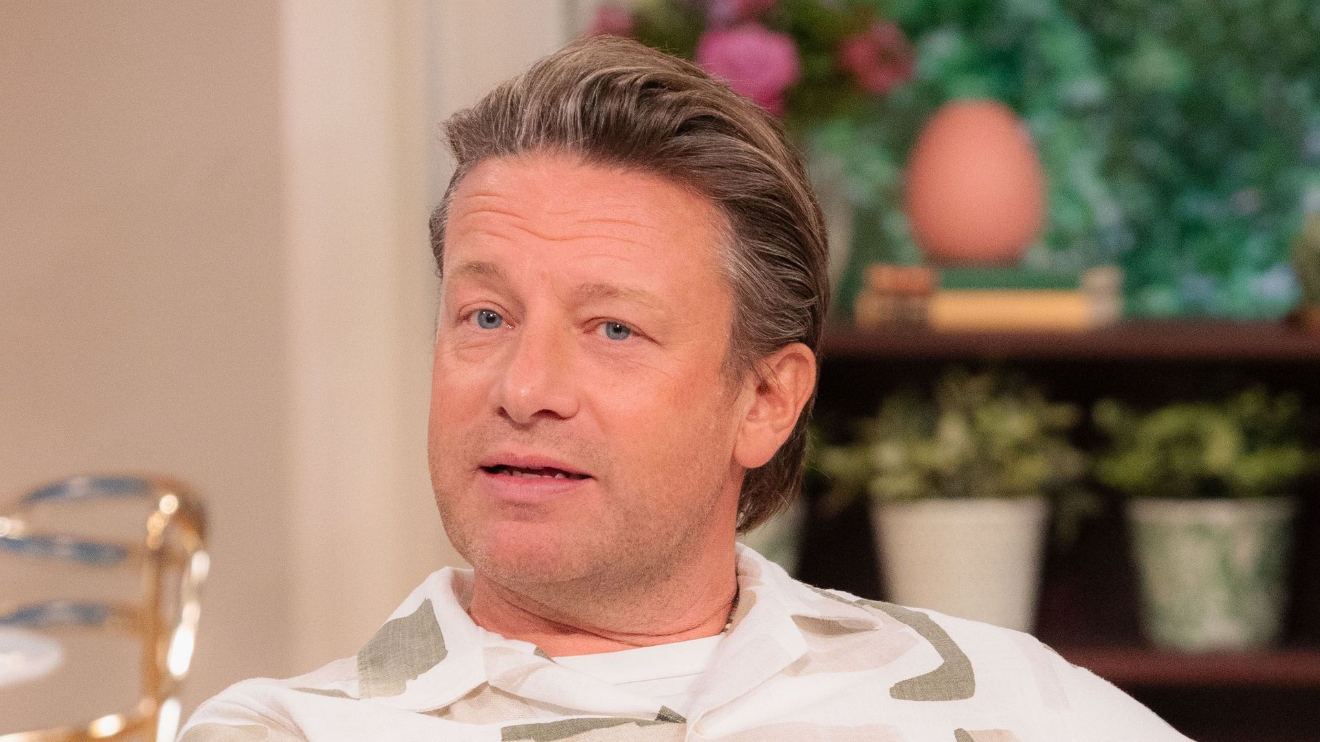 Jamie Oliver on This Morning sofa in white printed shirt