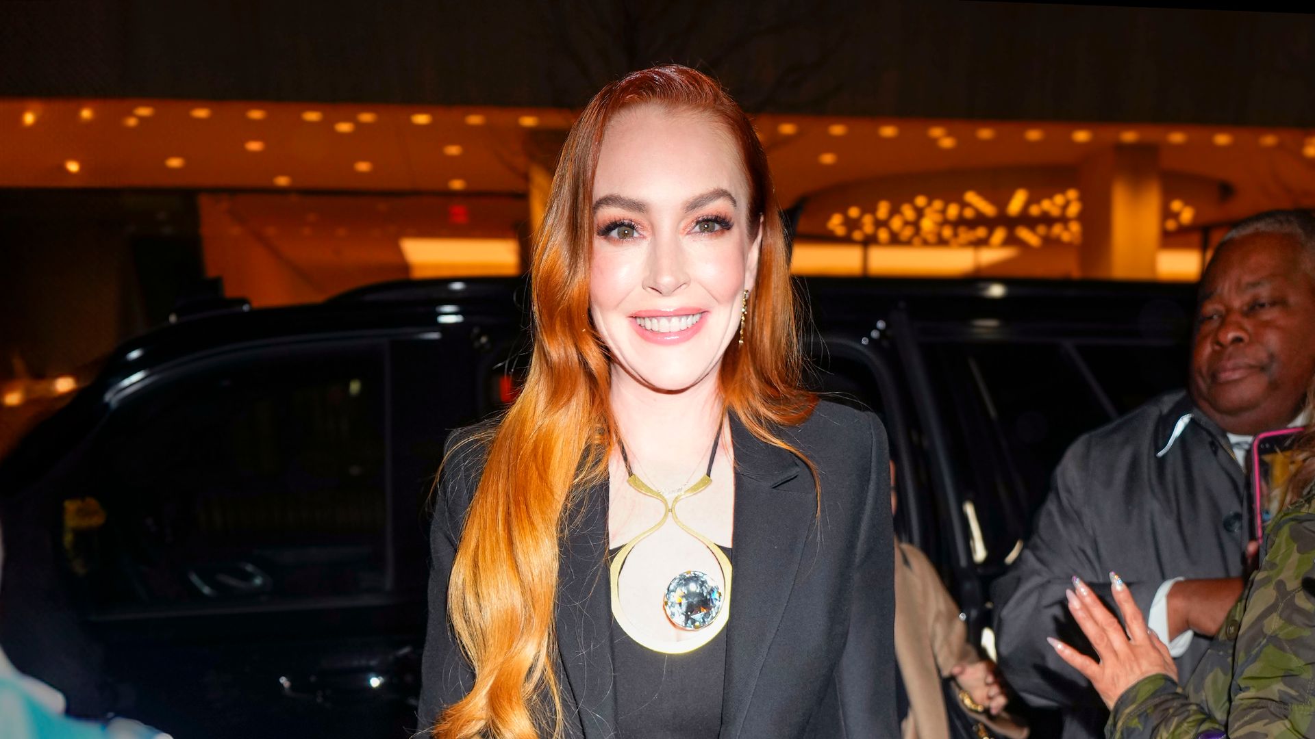 Lindsay Lohan commands attention in chic pantsuit seven months after giving birth