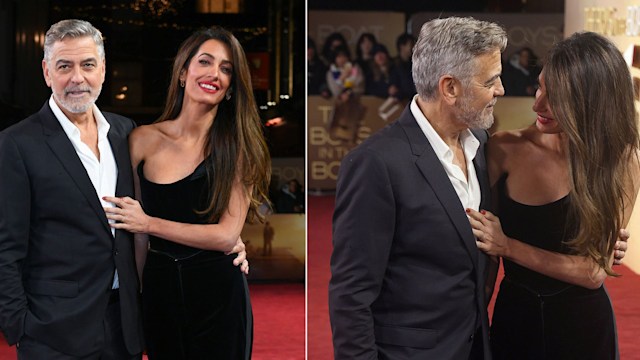 Amal and George Clooney posing together on the red carpet in London