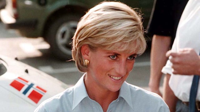 Princess Diana wearing a blue shirt