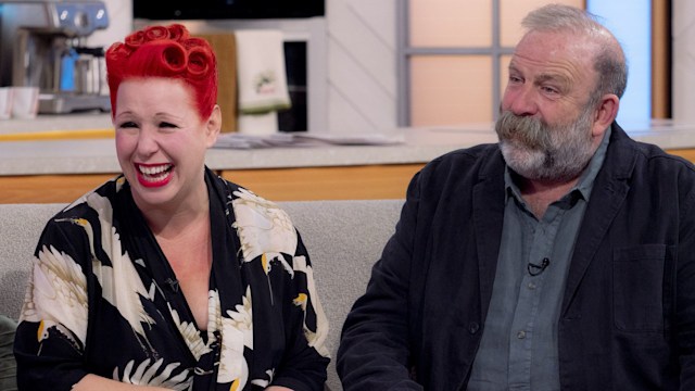 Dick Strawbridge, Angel Strawbridge laughing sat on sofa