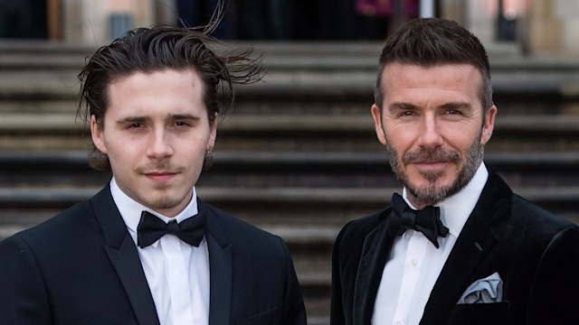 Brooklyn Beckham and David Beckham in black tuxedos