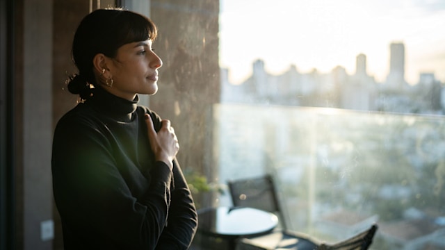 Young woman contemplating at home