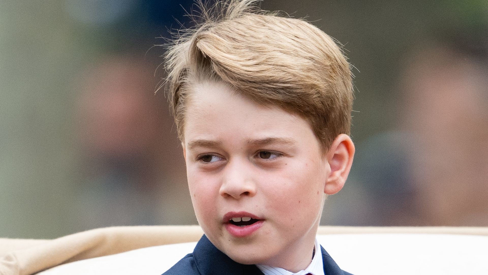 Prince George in a suit and red tie