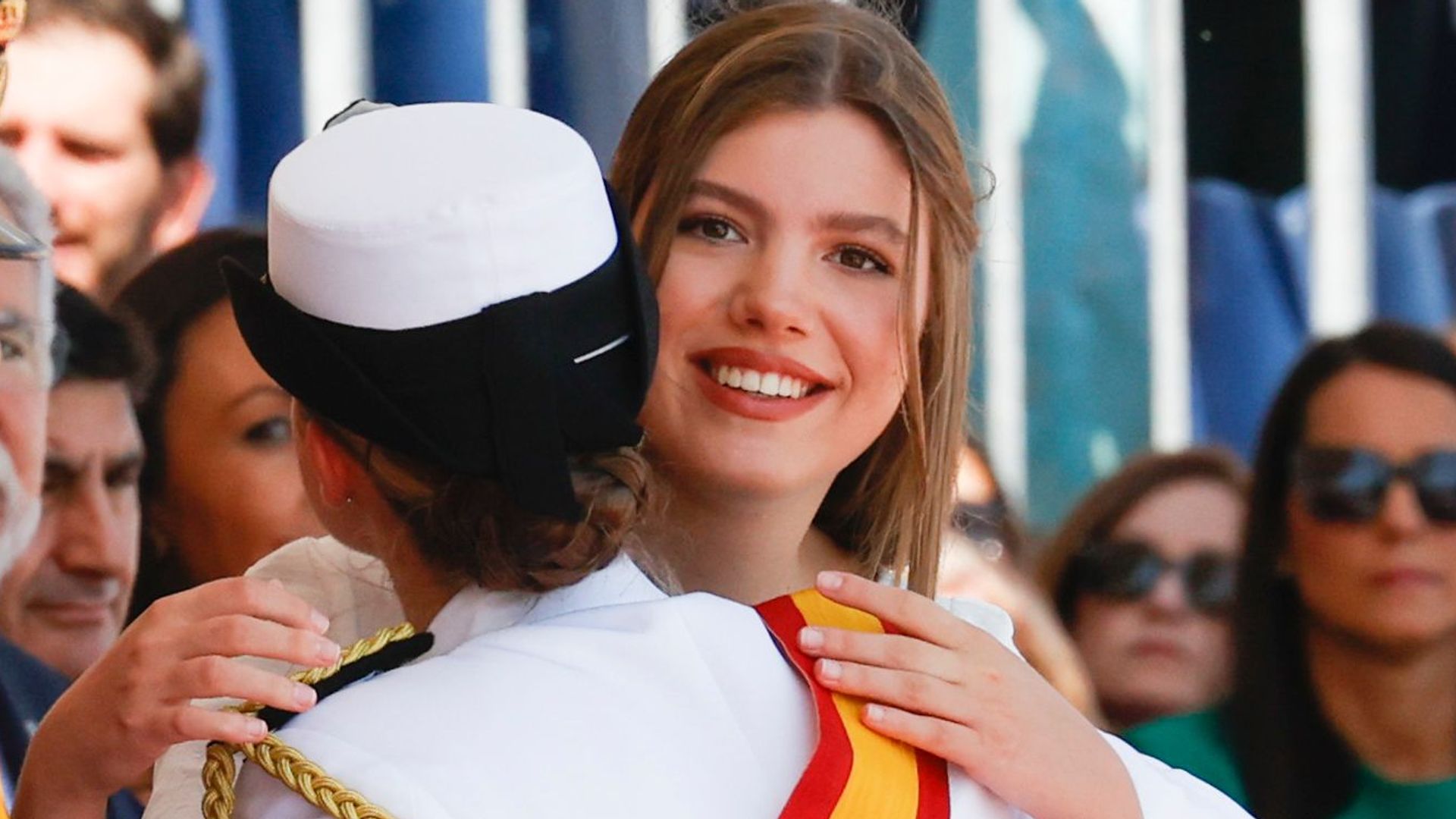 Infanta Sofia hugging Princess Leonor at naval ceremony