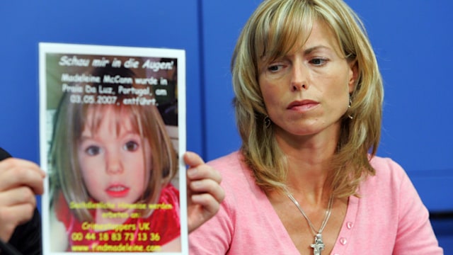 Kate McCann, the mother of the missing 4-year-old British girl Madeleine McCann looks at a poster showing her missing daughter during a press conference in 2007