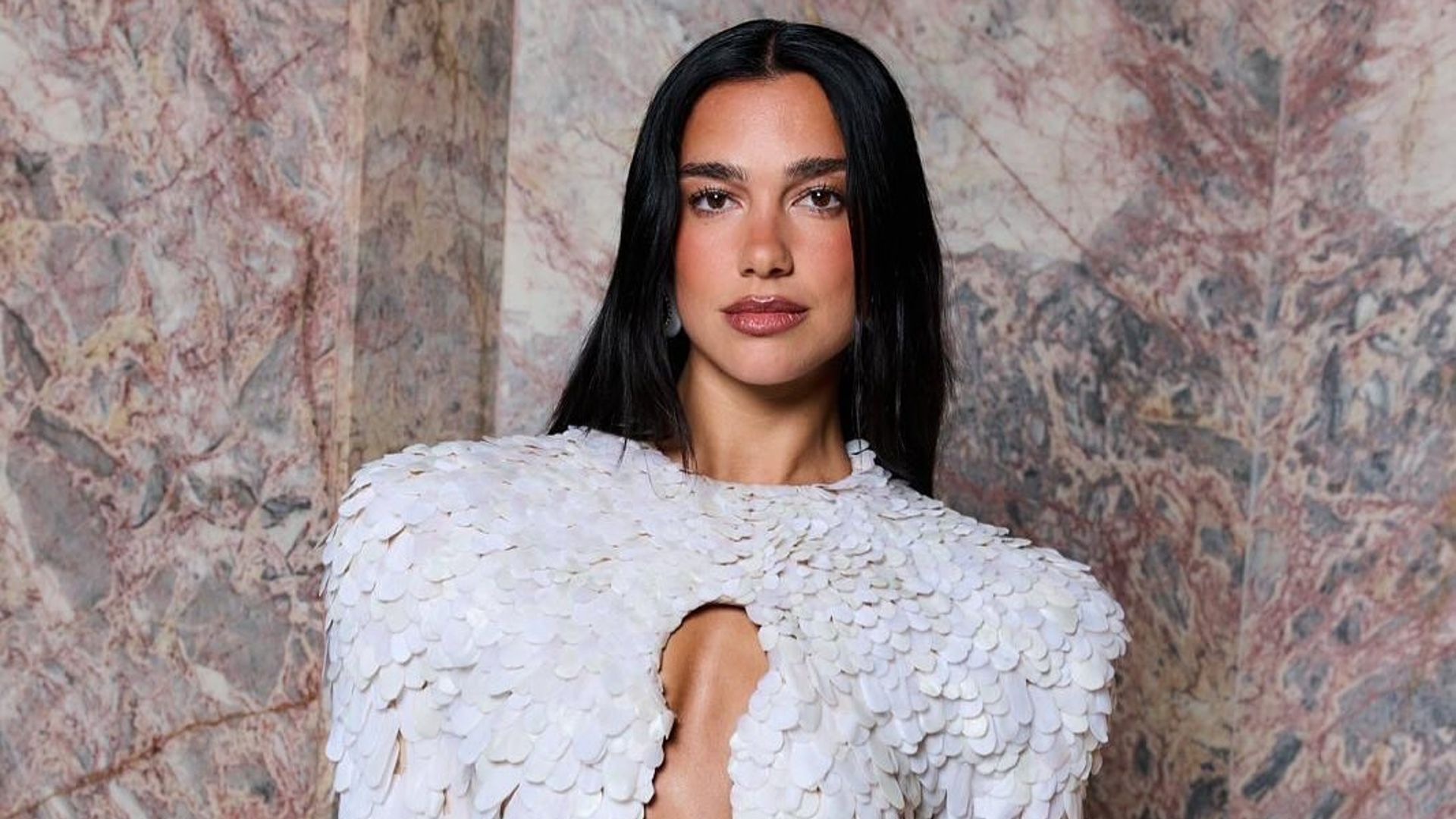 Dua Lipa wears a white gown at Couture week 2025