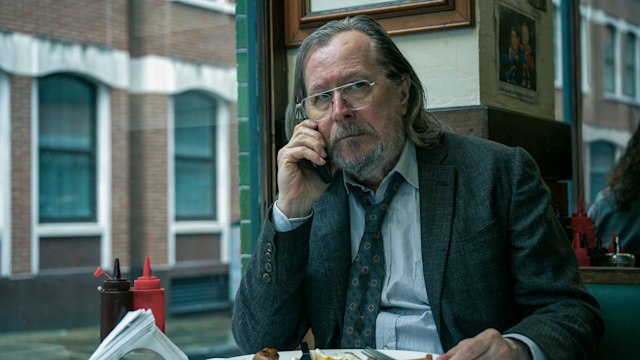 man on phone in cafe