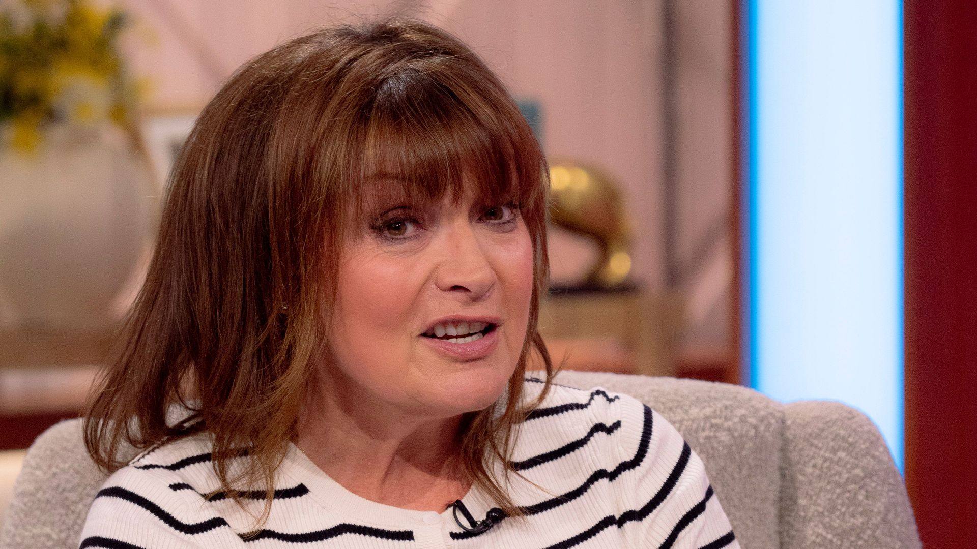 Lorraine Kelly in a striped top on her show