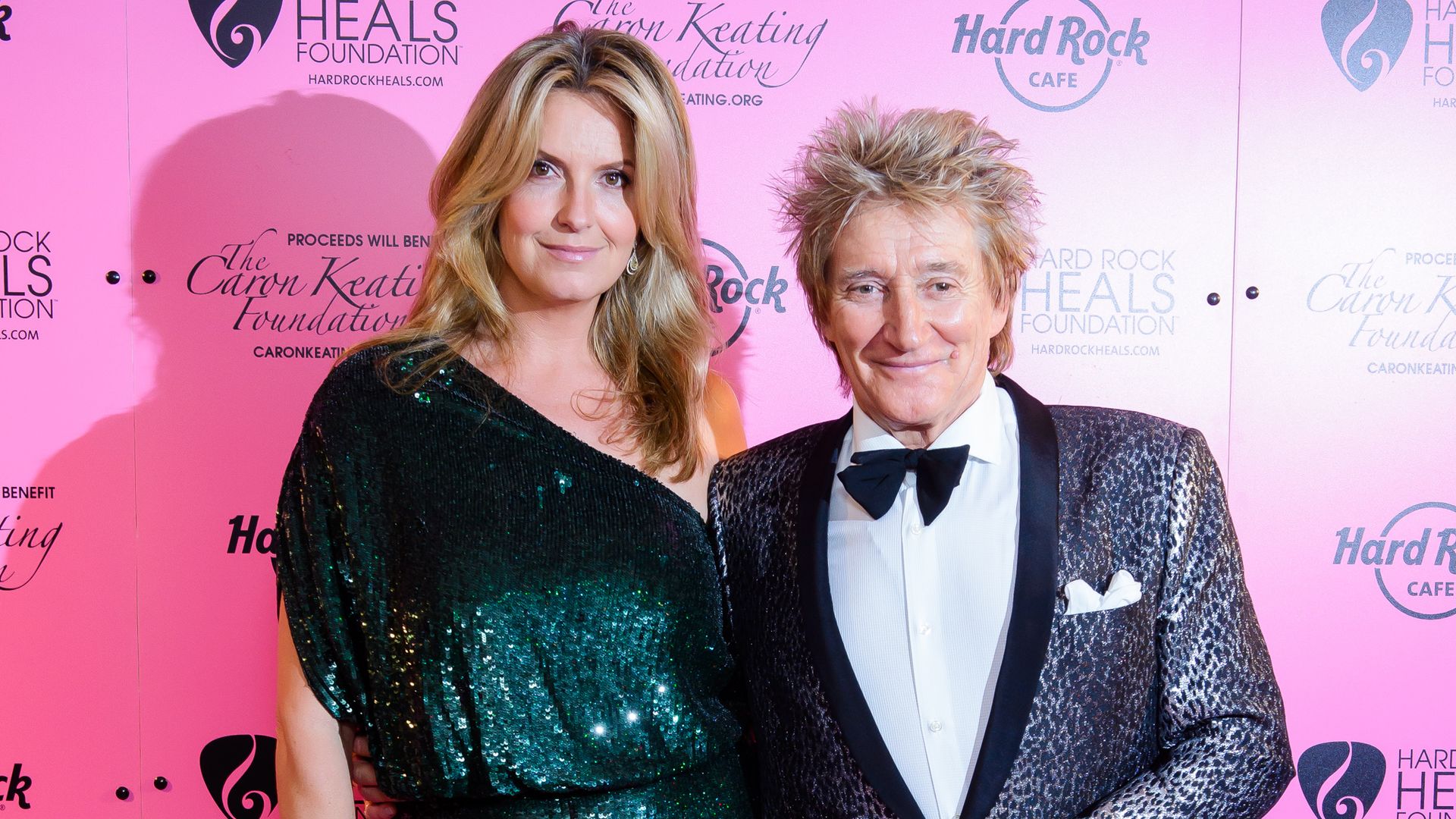 Penny Lancaster in mini dress with Rod Stewart in a suit