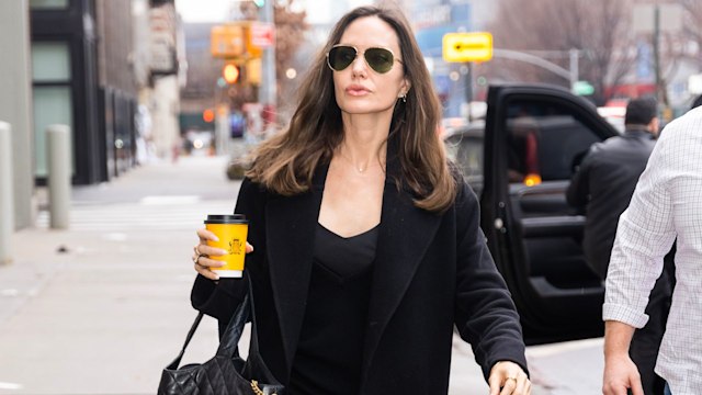 angelina jolie with ysl bag and coffee