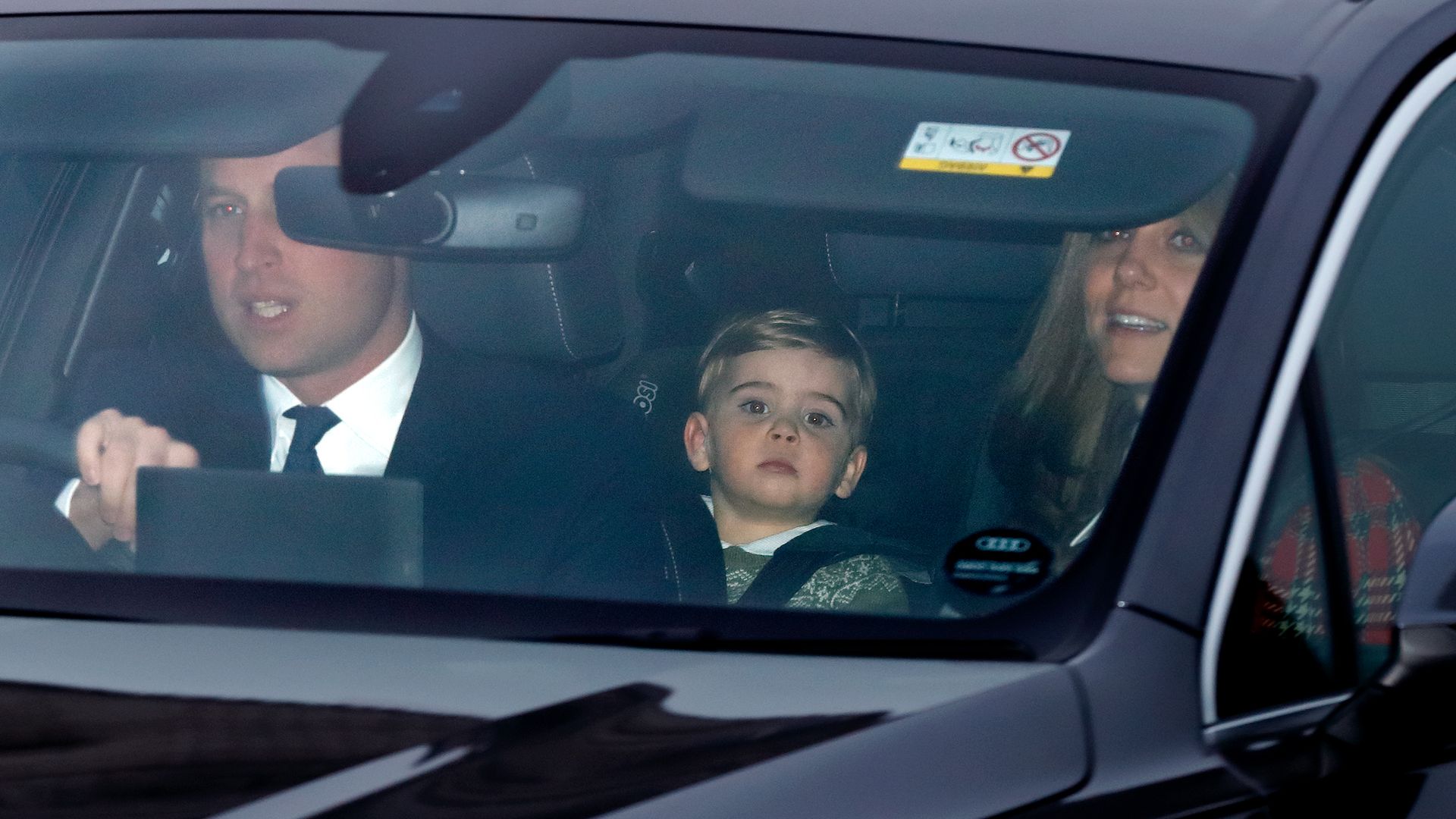 william, kate and Prince Louis riding in car 