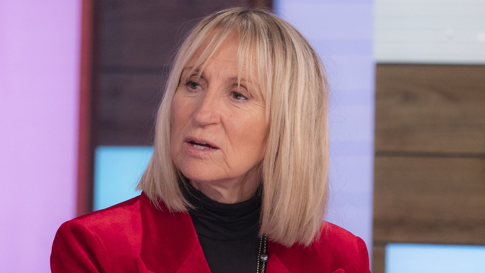 Carol McGiffin in a red jacket on Loose Women