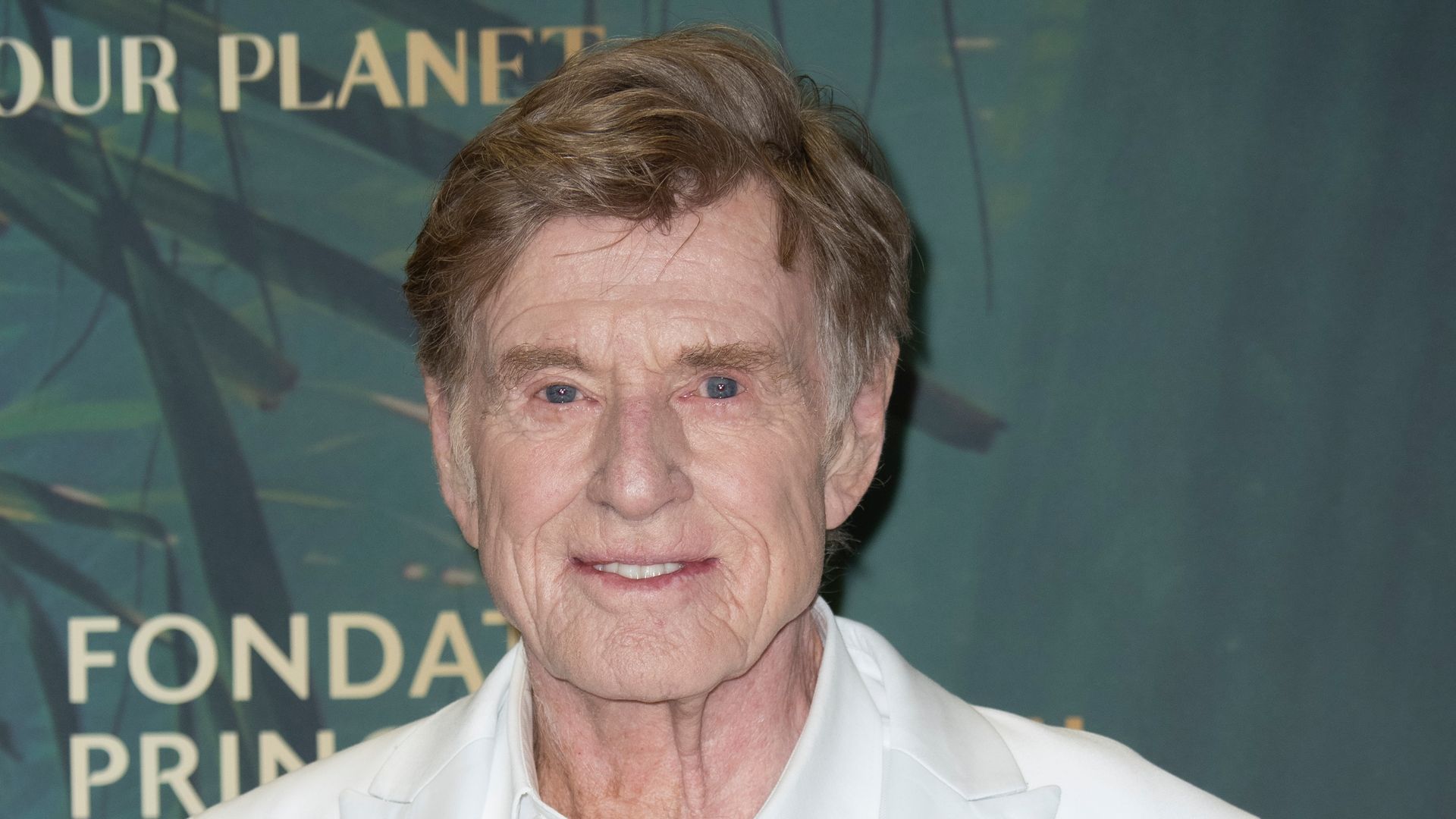 photo of robert redford in white suit