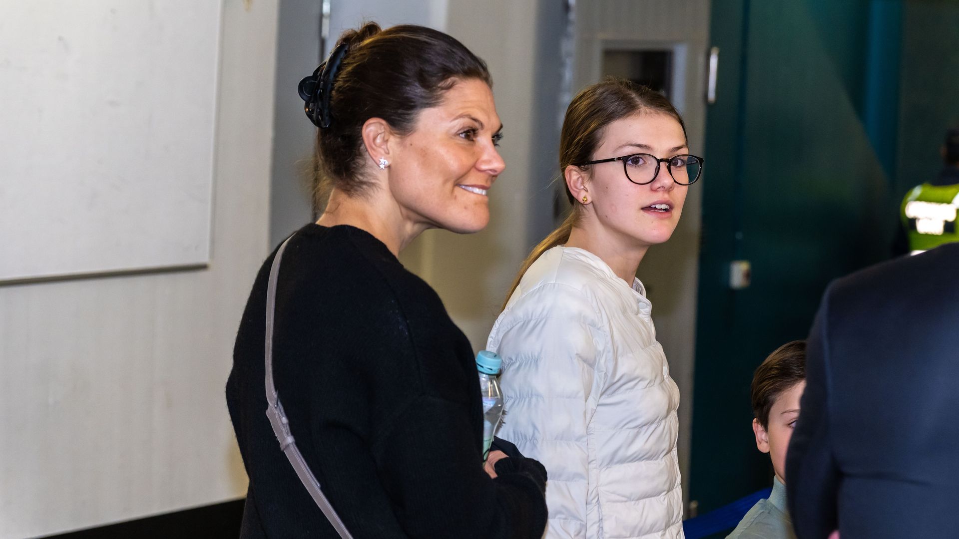 Crown Princess Victoria and Princess Estelle arriving at a hockey match