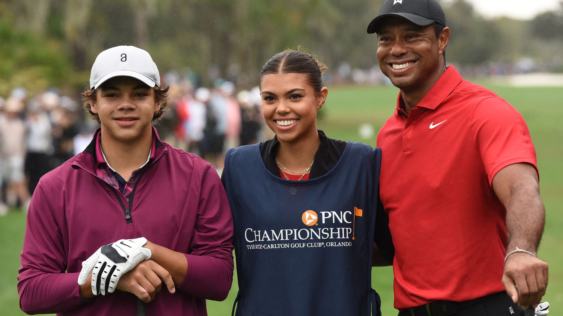 tiger woods on gold course with kids sam and charlie