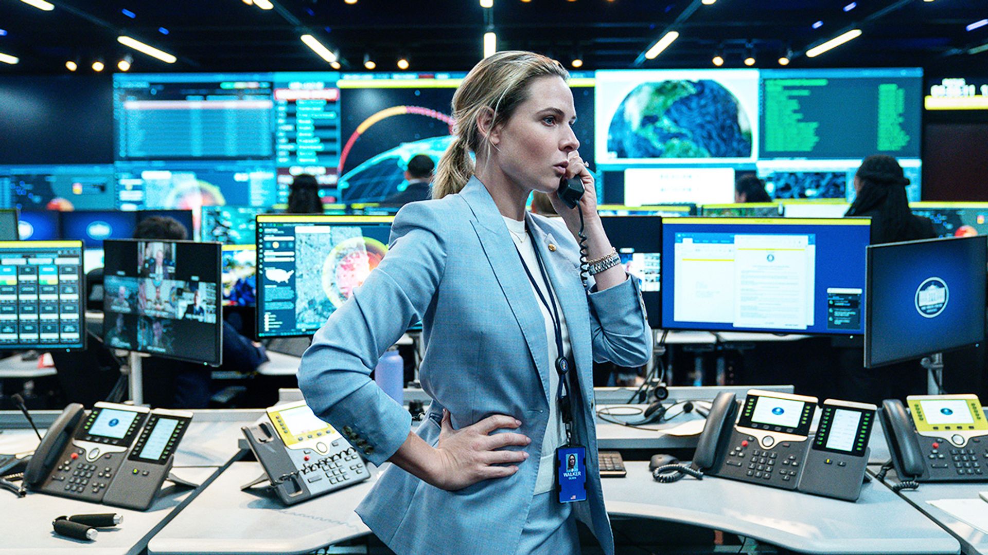 woman in blue sit on phone