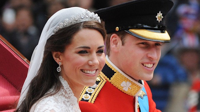 Prince William and Kate wave to crowds following their wedding