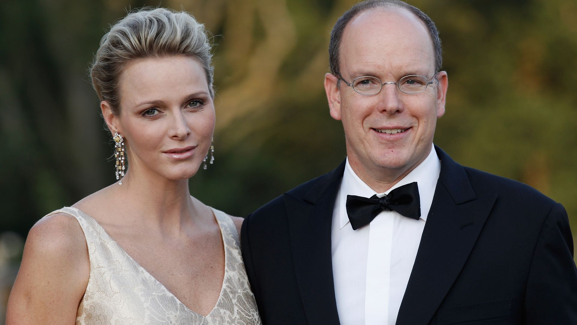 Princess Charlene and Prince Albert smiling in a close-up photo 