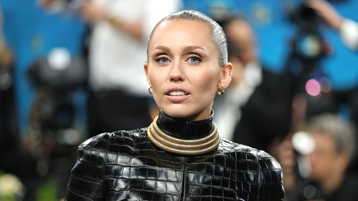 Miley Cyrus schools us on how to wear a leather mini skirt and sheer tights for date night