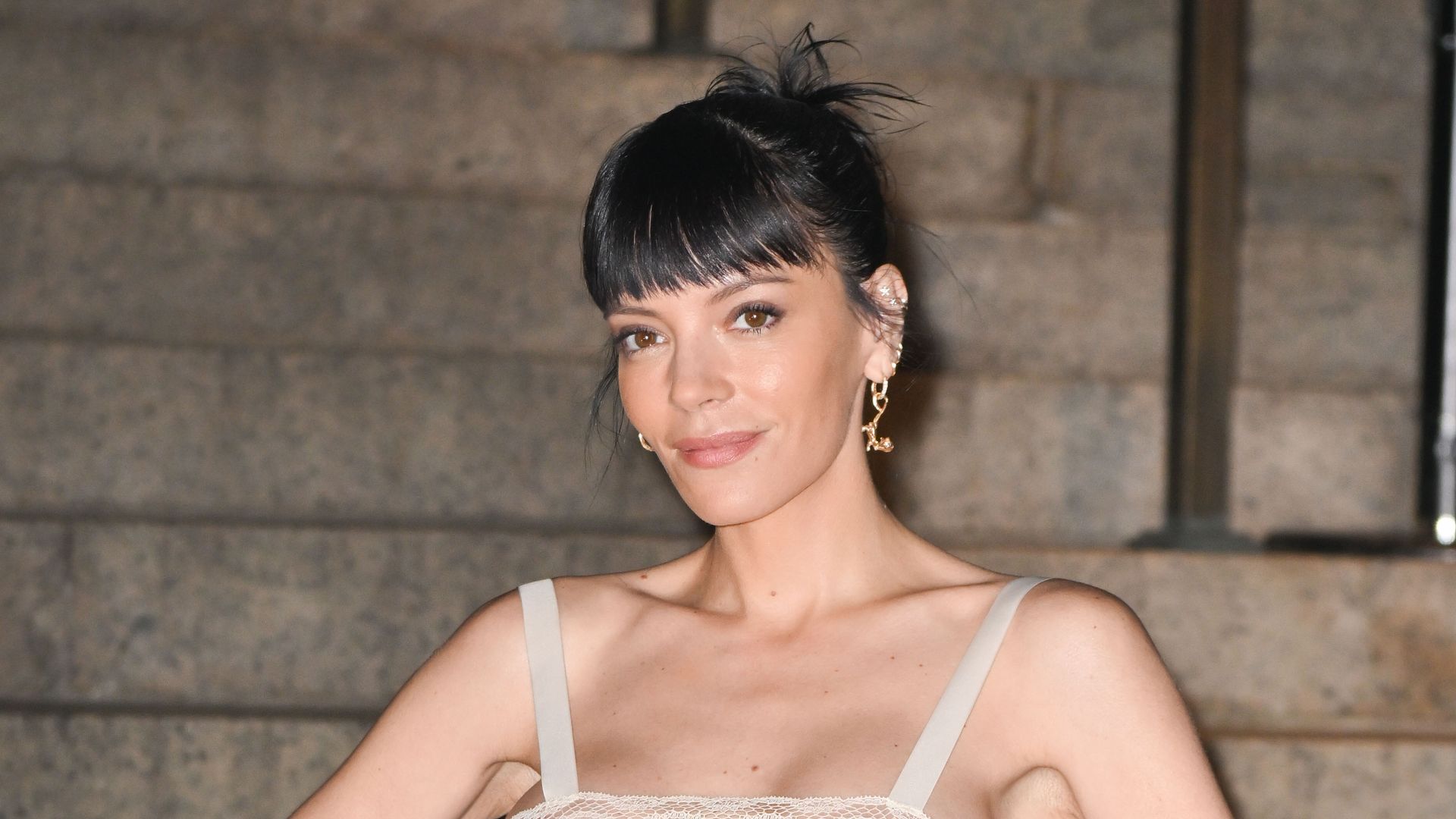 Lily Allen cosies up with rumored beau at Christmas party