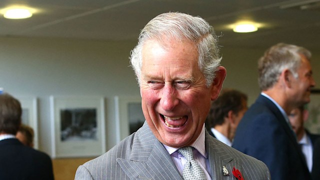 charles with thumbs up holding teacup