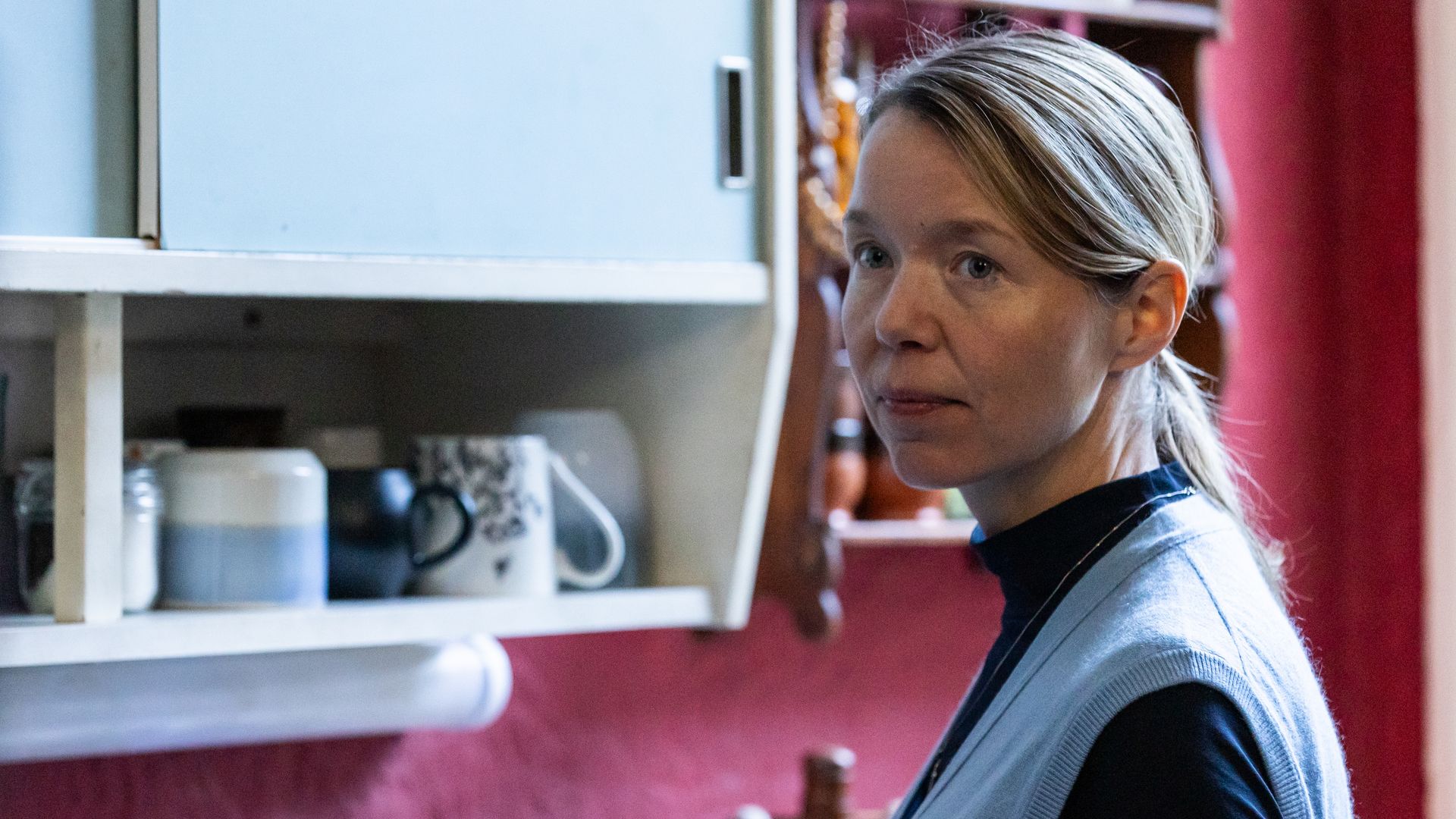 lose-up of woman standing in kitchen