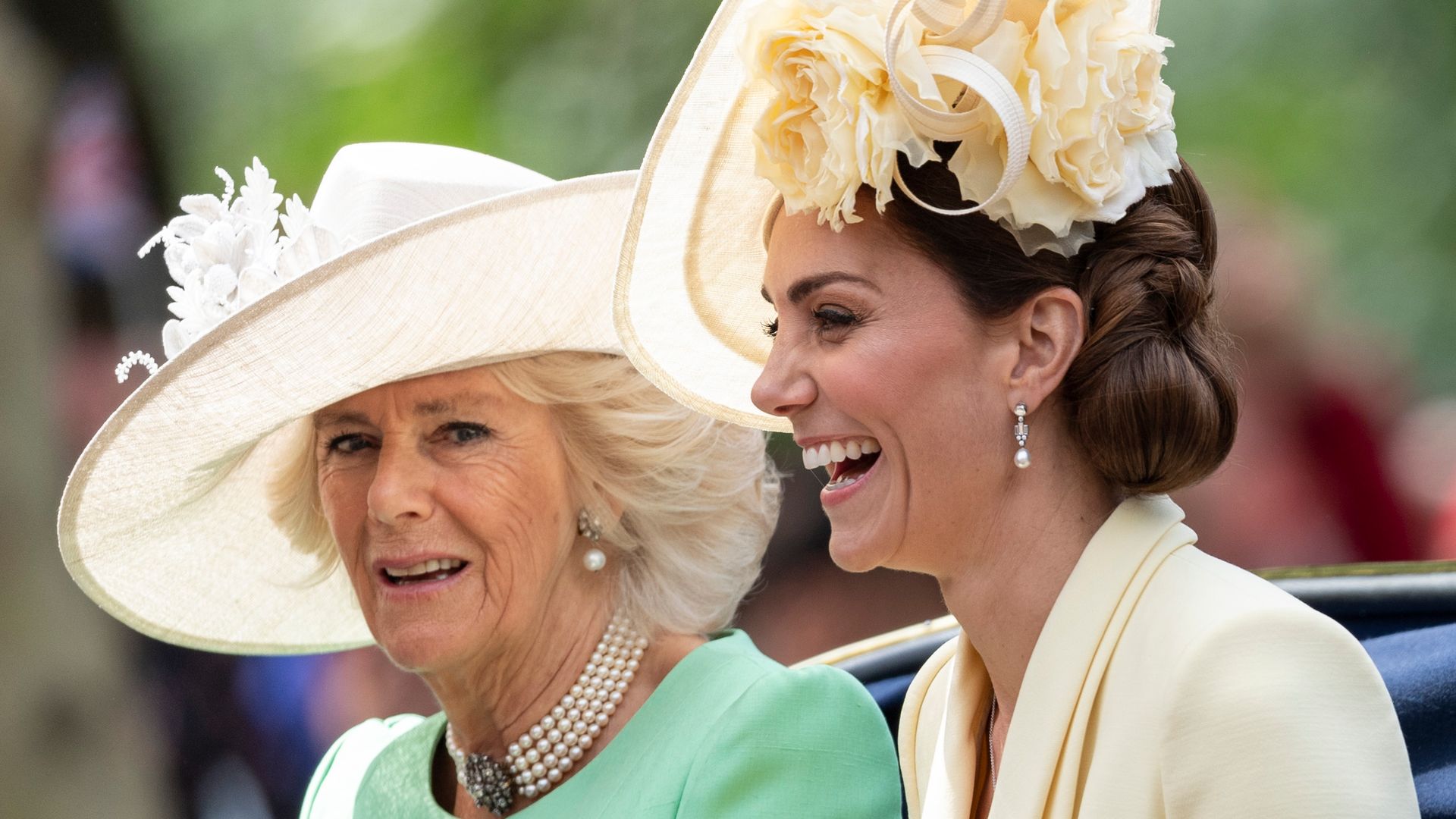 Queen Camilla and Princess Kate laugh during the Trooping The Colour ceremony in 2019