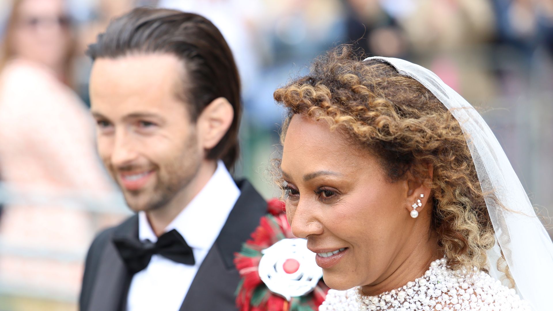 Melanie Brown in pearl bridal gown and her husband hairdresser Rory McPhee