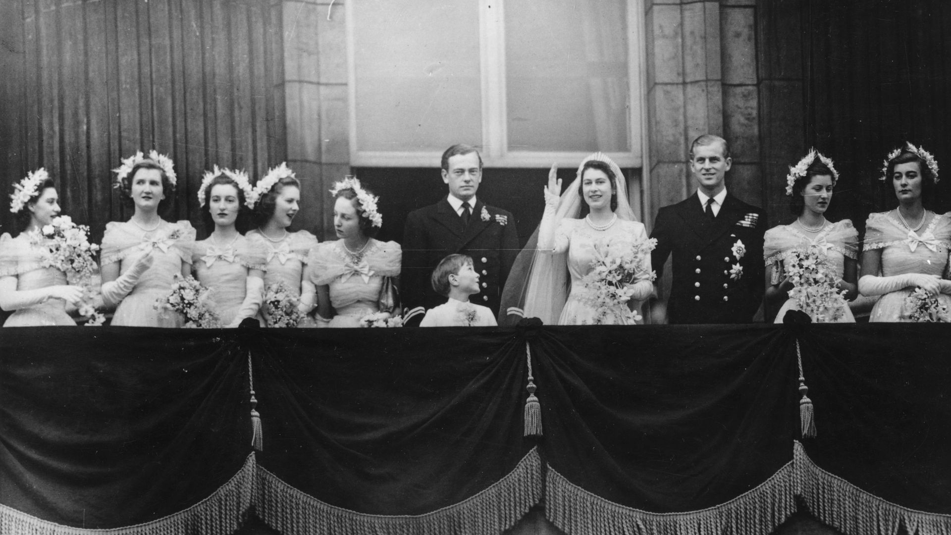 A group of people on the Buckingham Palace balcony