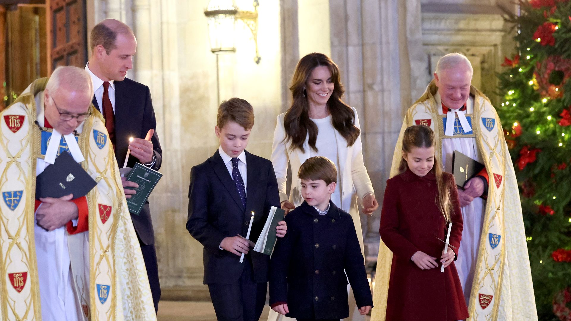 Catherine, Princess of Wales, Prince Louis of Wales, Princess Charlotte of Wales, Prince William, Prince of Wales and Prince George of Wales process out of The "Together At Christmas" Carol Service at Westminster Abbey