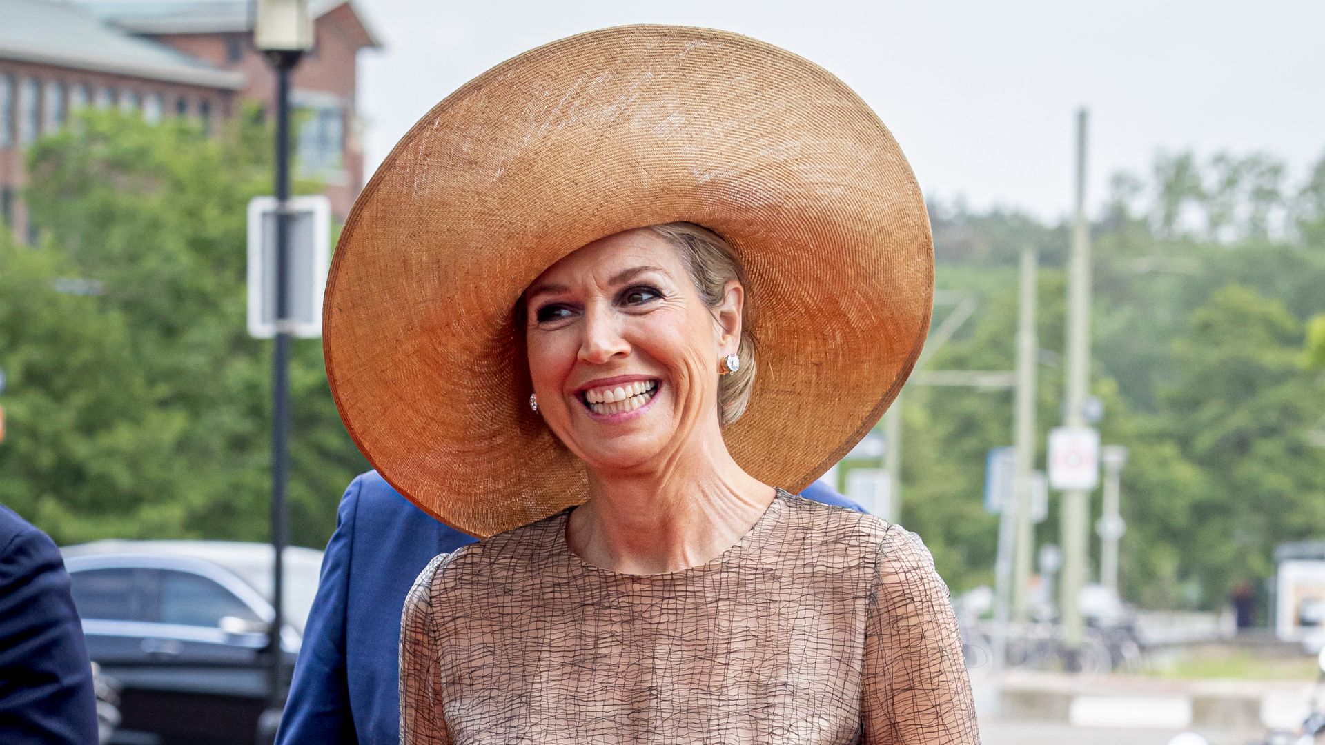 Queen Máxima exudes glamour in waist-defining dress and sky-high heels
