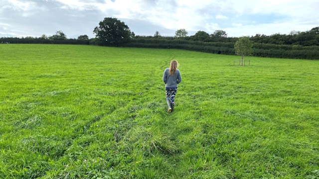 Woman walking in a field 