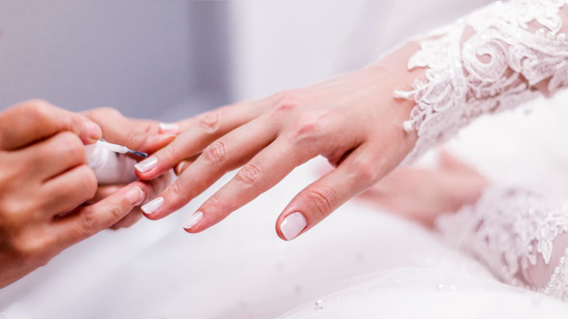 Bride having her nails painted