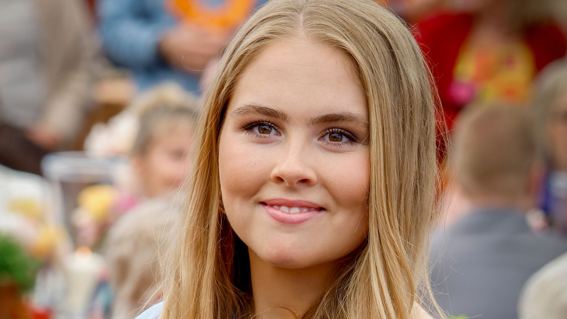 Princess Catharina-Amalia smiling in blue dress