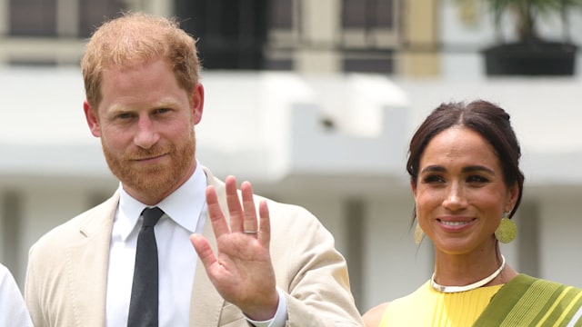 Prince Harry and Meghan Markle pose for a photo