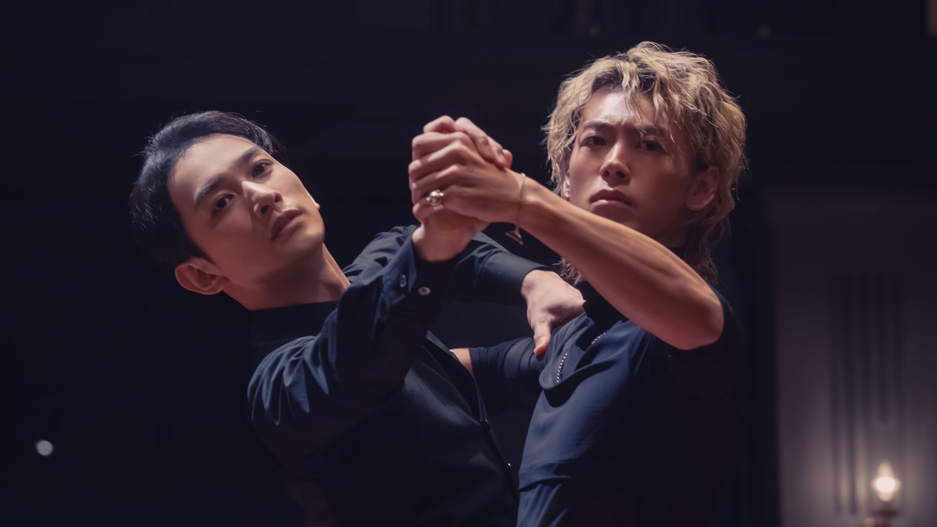 Ryoma Takeuchi and Keita Machida in a ballroom hold in a scene from 10Dance