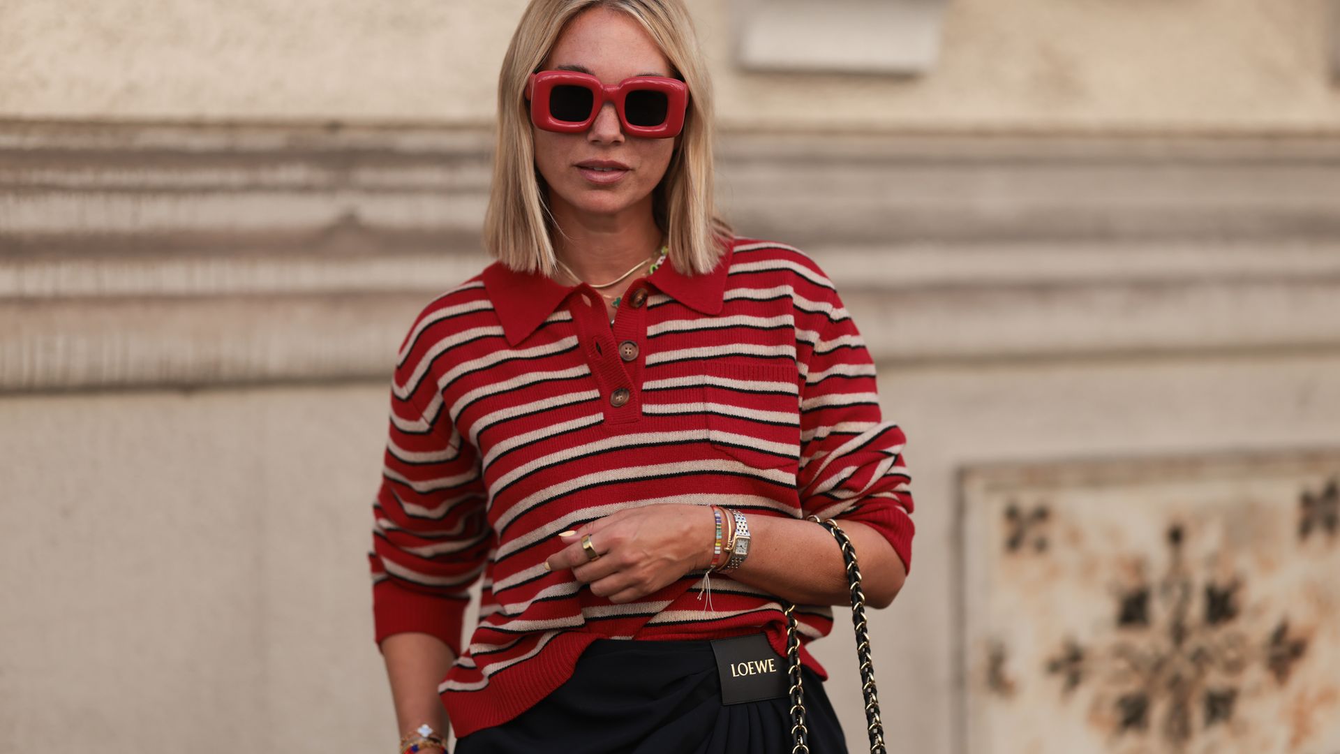 Woman wearing red and white striped rugby top